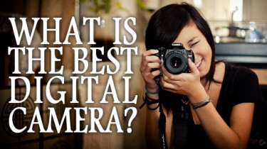 Image of a girl taking a picture and words: "What is the best digital camera?"